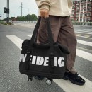 Expandable wheeled travel bag with retractable handle