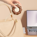 Donut-shaped portable lint remover