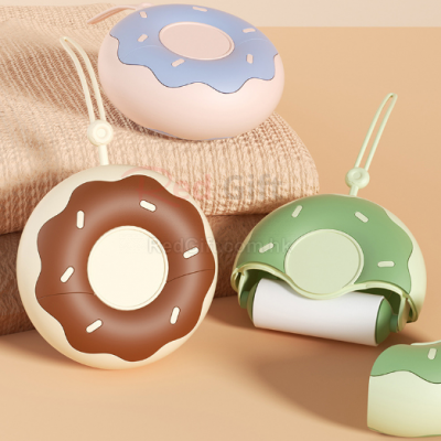 Donut-shaped portable lint remover
