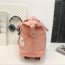 Expandable wheeled travel bag with retractable handle