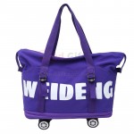 Expandable wheeled travel bag with retractable handle