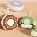Donut-shaped portable lint remover