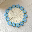 Woven flower cup mat